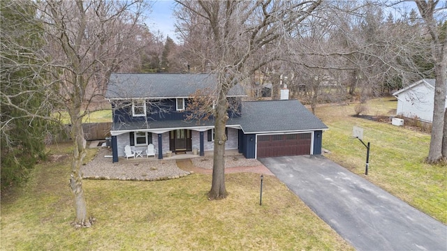 view of front facade featuring a front lawn, aphalt driveway, covered porch, an attached garage, and a shingled roof