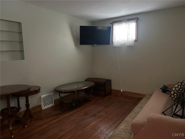 interior space featuring hardwood / wood-style flooring and visible vents