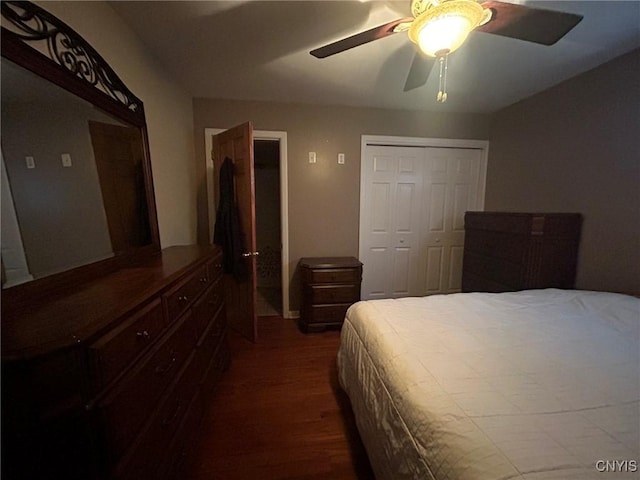 bedroom with a closet, dark wood finished floors, and a ceiling fan