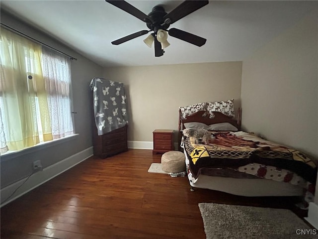 bedroom with hardwood / wood-style floors, baseboards, and ceiling fan