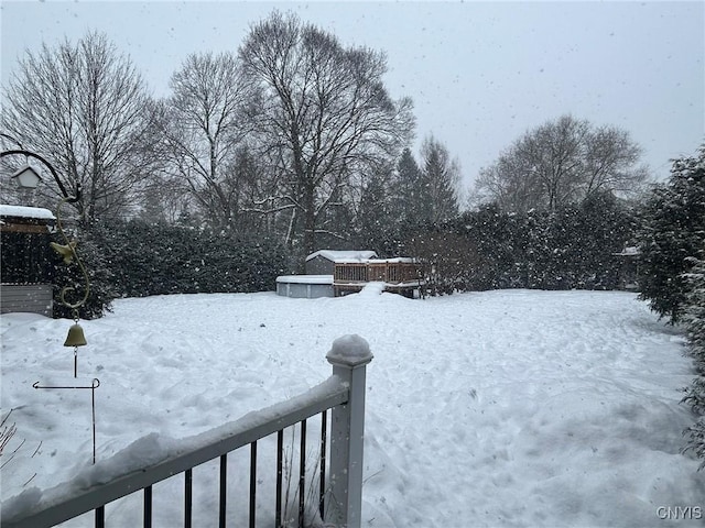 view of yard layered in snow