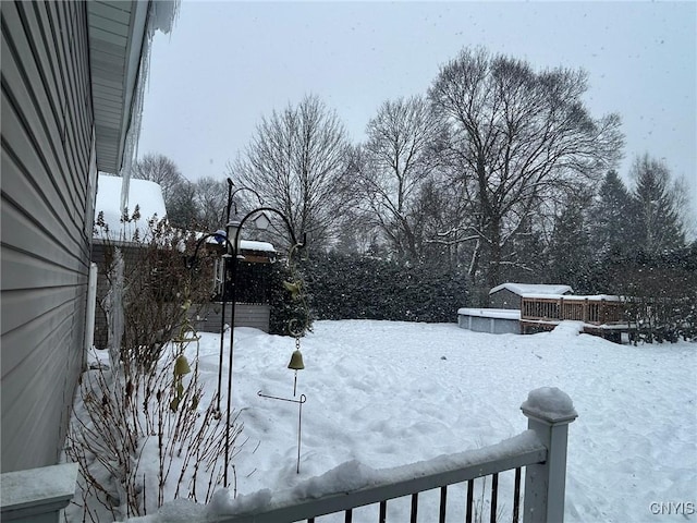 view of yard layered in snow