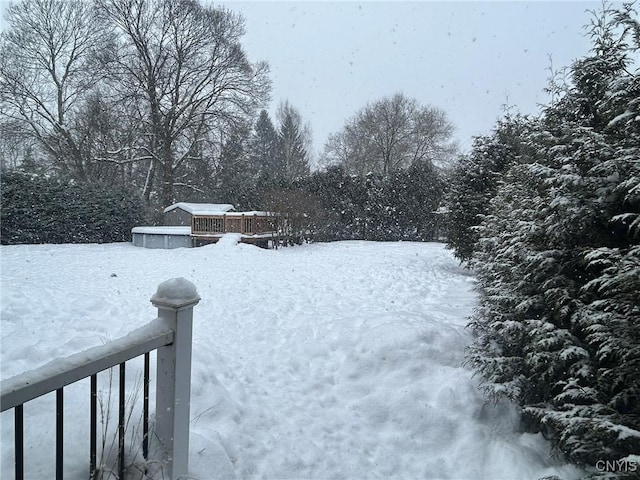 view of yard layered in snow