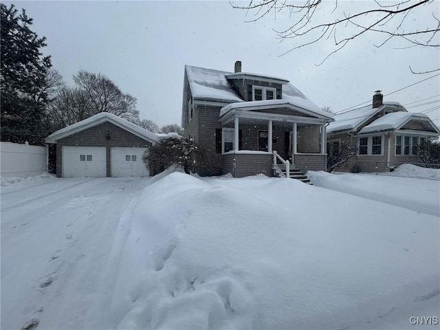 bungalow-style home featuring fence and a chimney