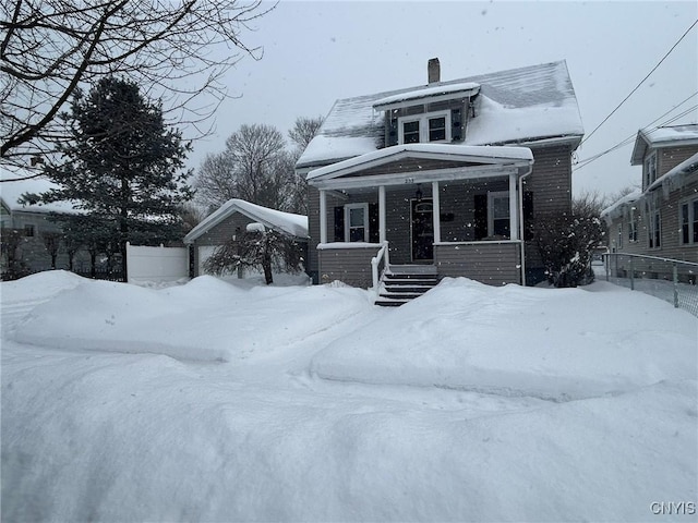 view of front of property with fence and covered porch