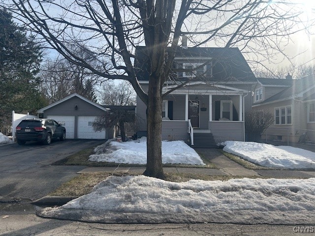 view of front facade featuring a porch and a garage