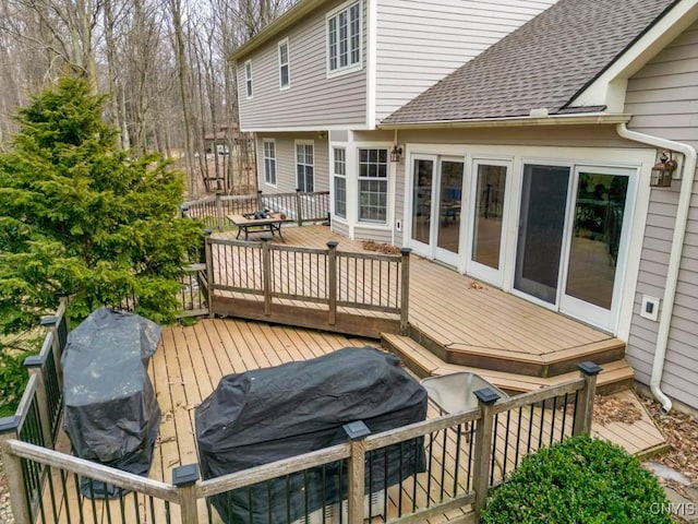 wooden deck featuring grilling area