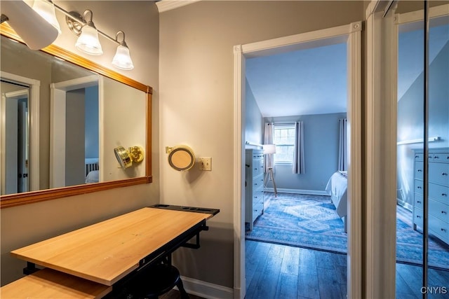 bathroom featuring baseboards and hardwood / wood-style floors