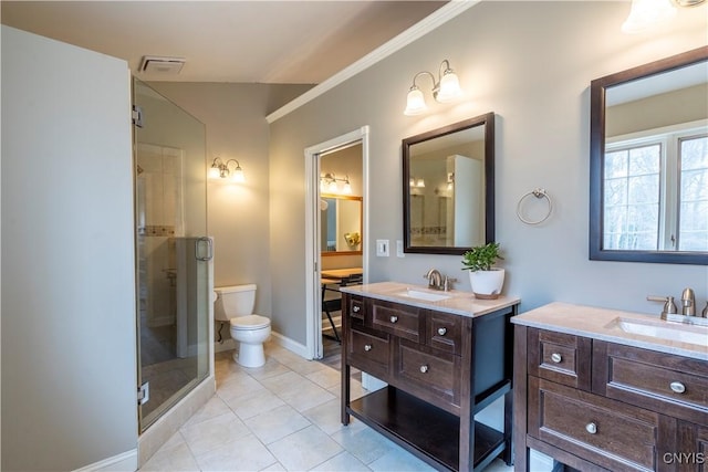 full bathroom with visible vents, a stall shower, two vanities, and a sink