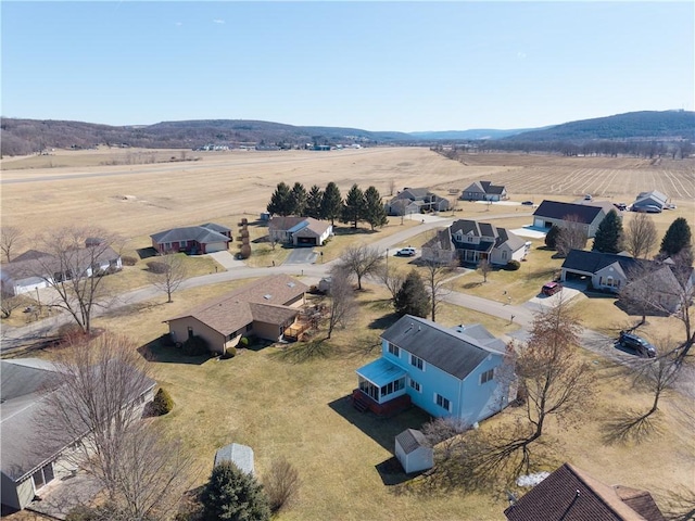 birds eye view of property with a rural view and a mountain view