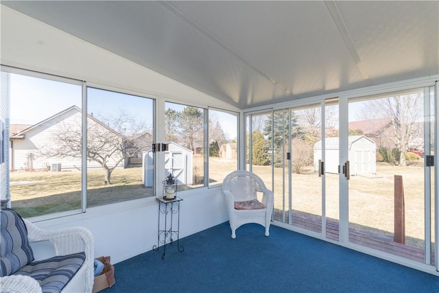 sunroom / solarium with vaulted ceiling