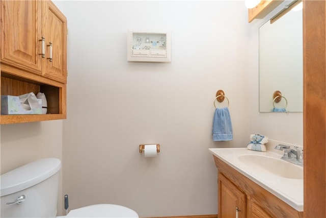 bathroom with toilet and vanity