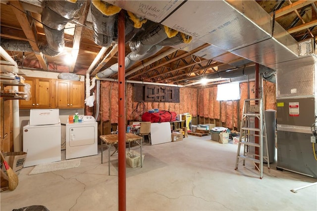 basement featuring washing machine and clothes dryer