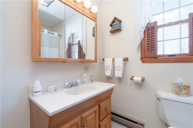 bathroom with vanity, toilet, a baseboard heating unit, and a shower with curtain