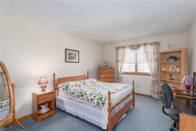 carpeted bedroom with baseboards