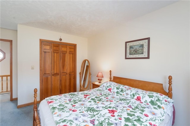 carpeted bedroom with baseboards, a closet, and a textured ceiling