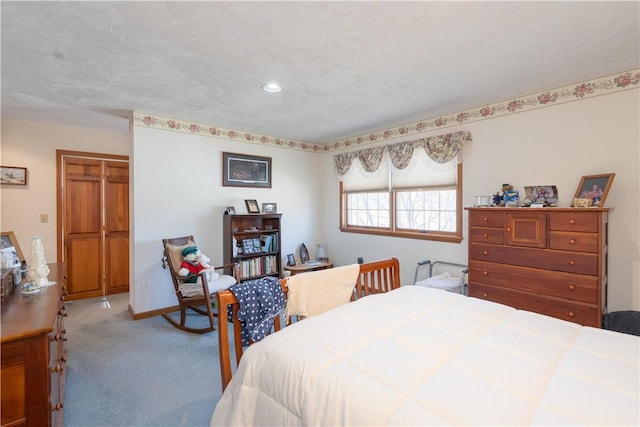 bedroom with baseboards and carpet floors