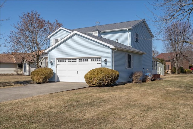 view of home's exterior with a yard, a garage, driveway, and a shingled roof