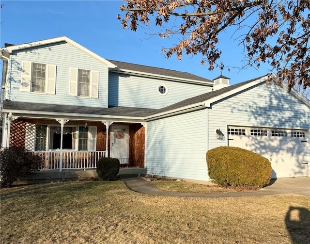 traditional home with driveway, a front yard, a porch, and an attached garage