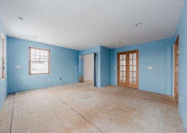 spare room featuring french doors