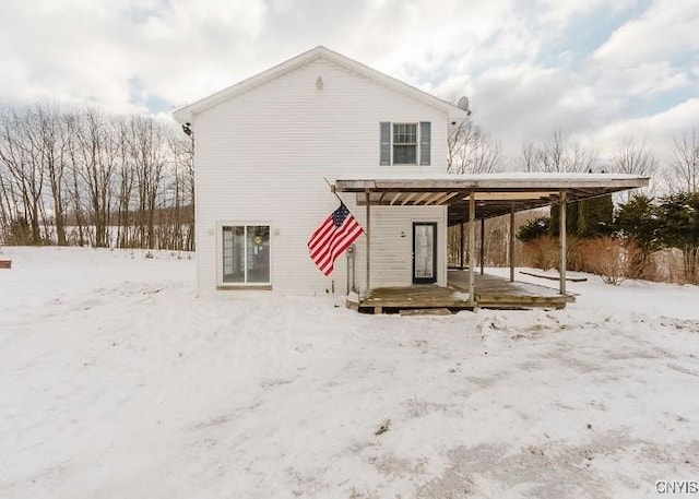 view of snow covered house