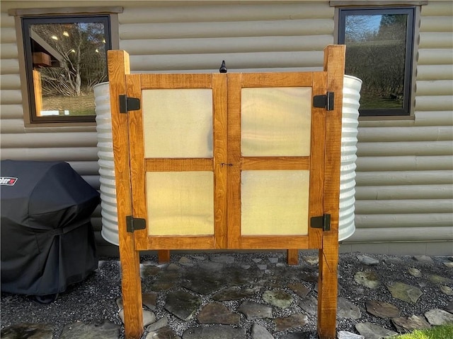 exterior details featuring log veneer siding