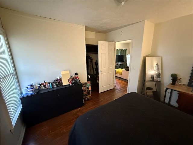 bedroom with wood finished floors