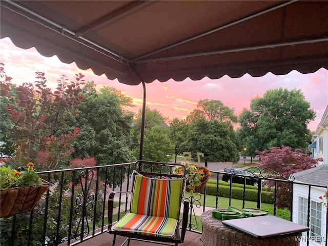 view of balcony at dusk