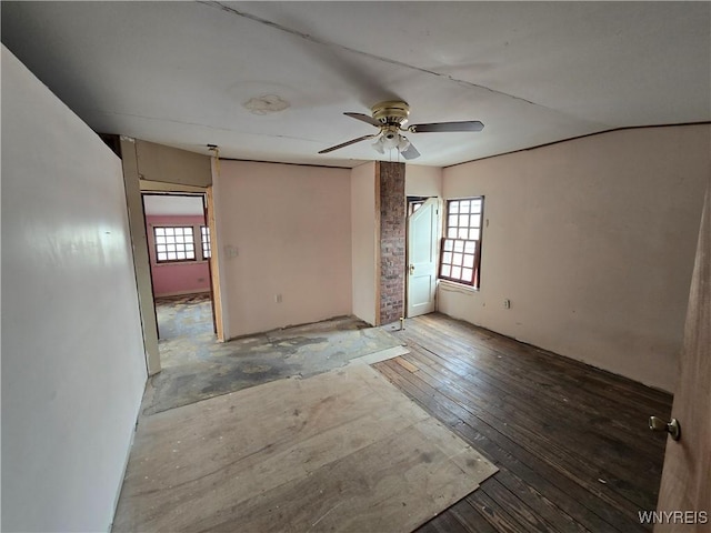 spare room with a ceiling fan and hardwood / wood-style flooring