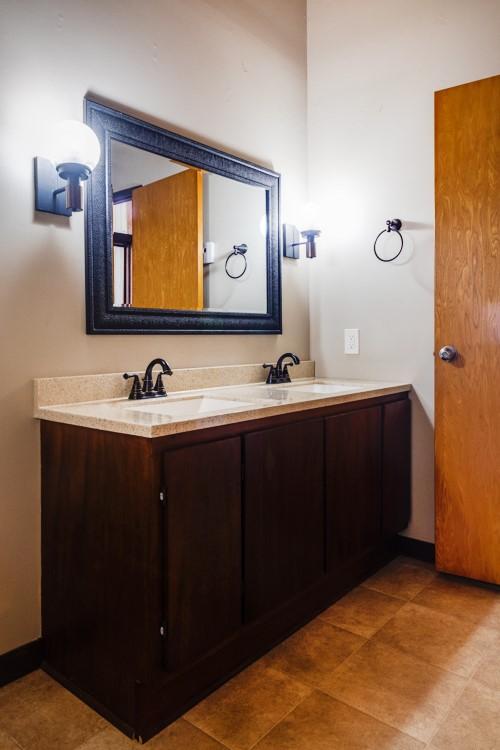 bathroom with double vanity and a sink