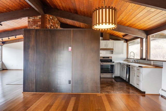 kitchen featuring dark wood-type flooring, tasteful backsplash, white cabinetry, appliances with stainless steel finishes, and vaulted ceiling with beams