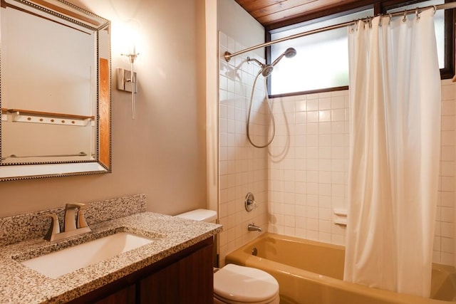 full bathroom with toilet, shower / bath combo with shower curtain, and vanity