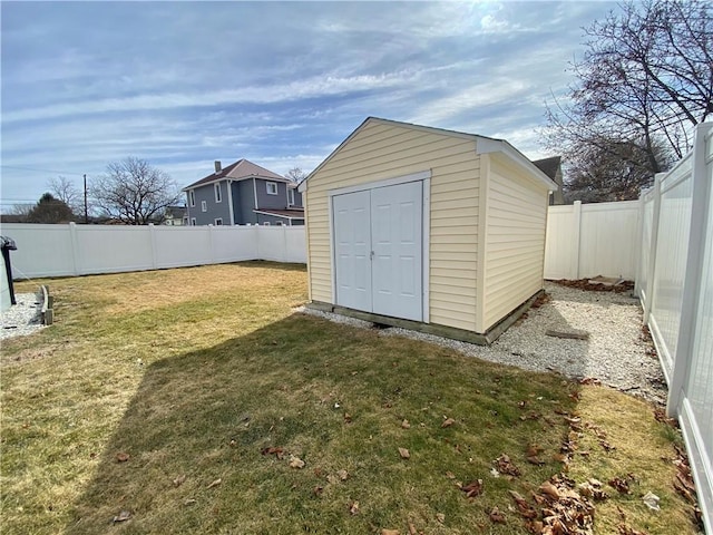 view of shed with a fenced backyard