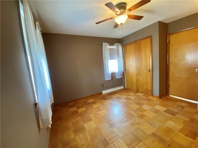 unfurnished bedroom with a closet and a ceiling fan