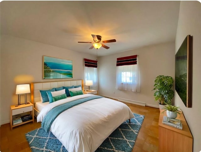 bedroom with baseboards and ceiling fan