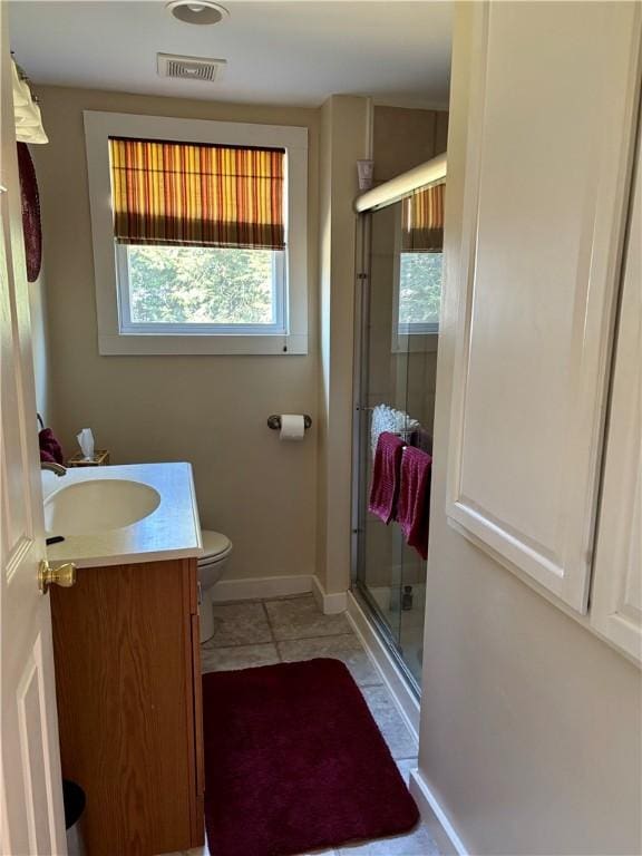 full bath featuring tile patterned flooring, visible vents, a shower stall, toilet, and vanity