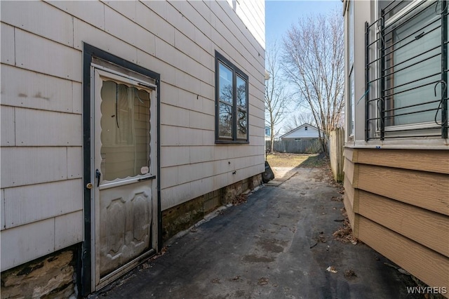 view of side of home with fence