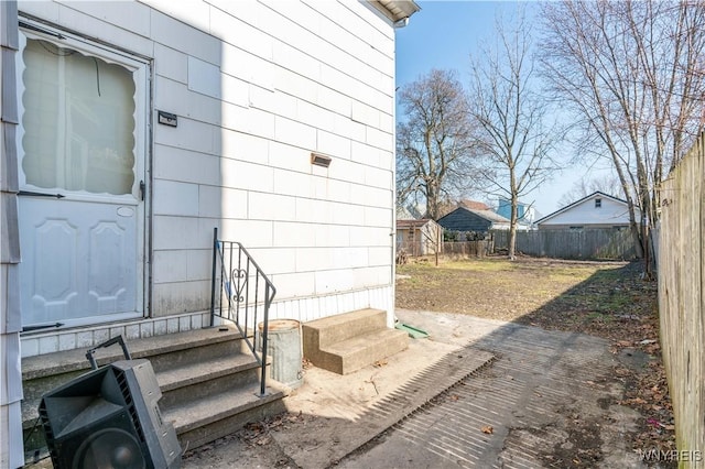 doorway to property with fence