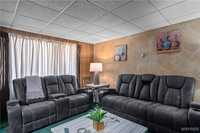 living room featuring a paneled ceiling