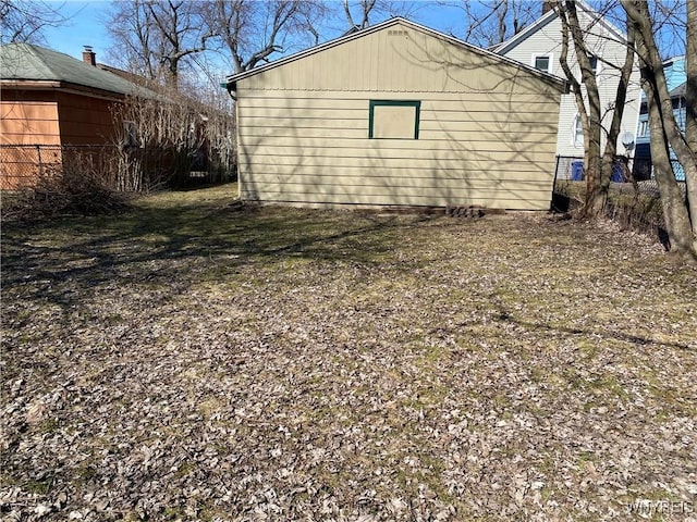 view of property exterior with fence