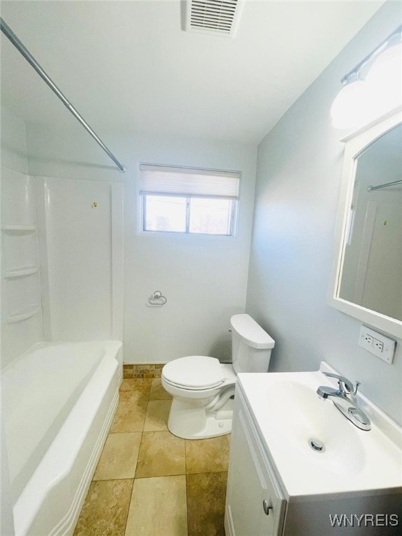 bathroom featuring vanity, baseboards, visible vents, bathing tub / shower combination, and toilet