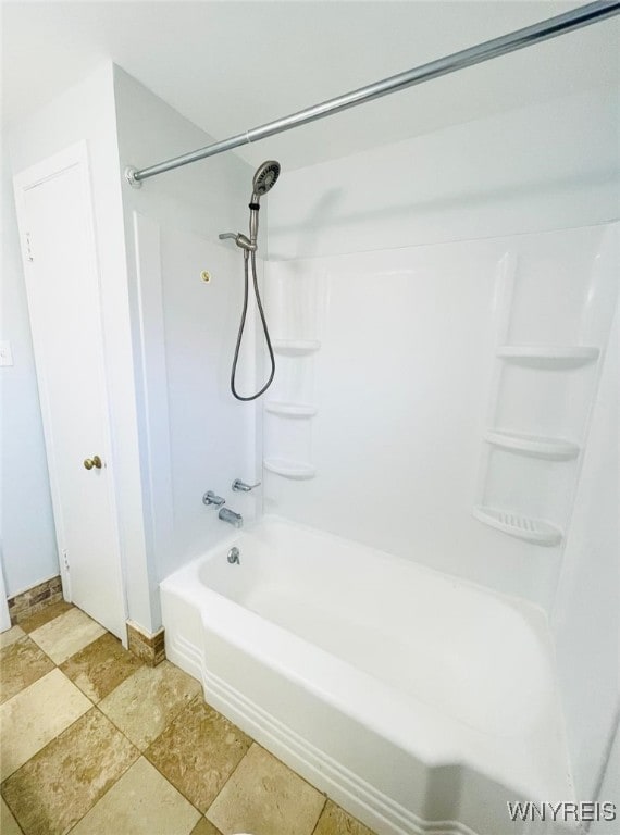 full bath with baseboards and shower / bathtub combination