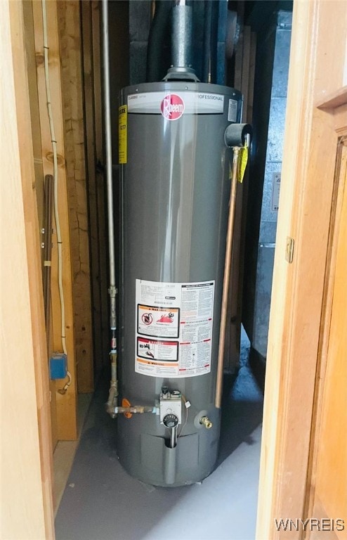 utility room with gas water heater