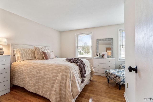 bedroom with wood finished floors