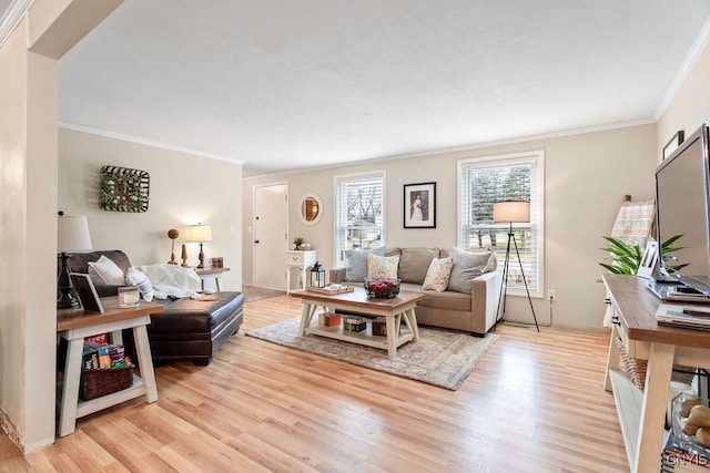 living area with light wood-style flooring and crown molding