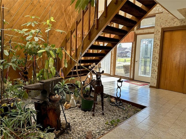 stairway with wallpapered walls