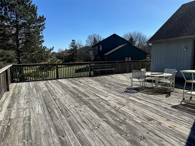 wooden terrace with outdoor dining area