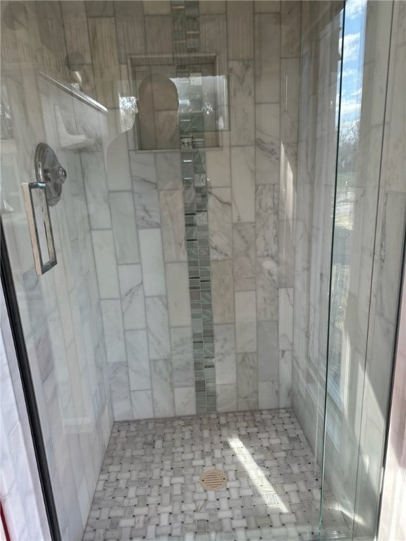 full bath with a shower stall