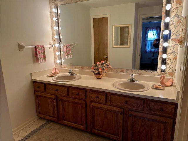 full bathroom featuring double vanity and a sink