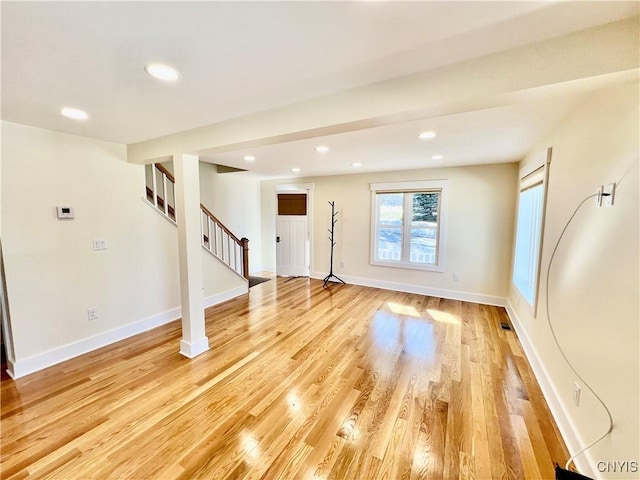 interior space with recessed lighting, light wood-style flooring, stairs, and baseboards